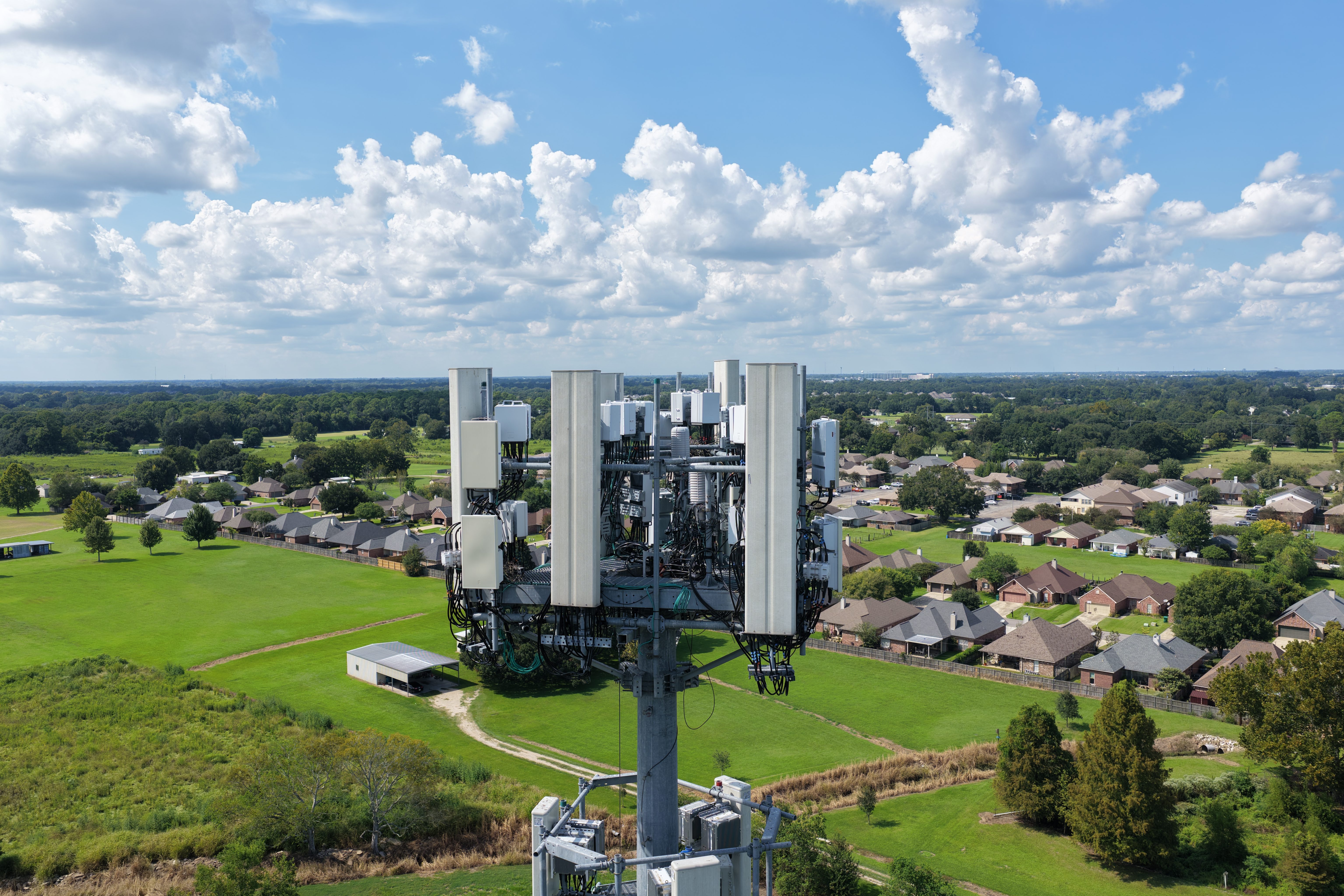 Aerial overview of telecommunications tower and surrounding site