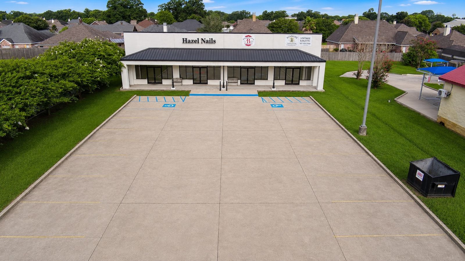 Aerial view of a commercial property and parking area
