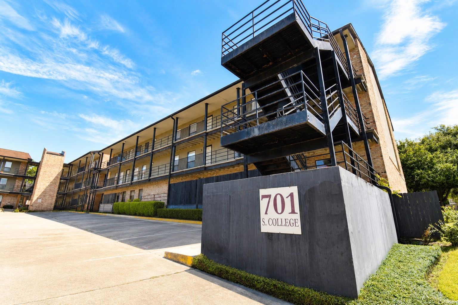 Multifamily property exterior and parking area