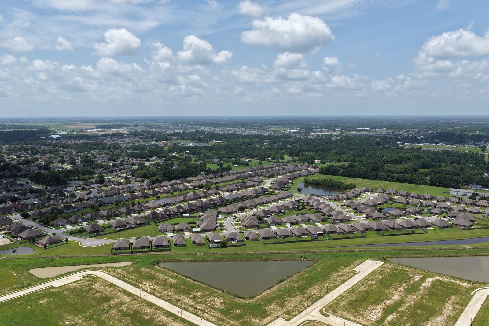 Wide aerial overview of a residential neighborhood