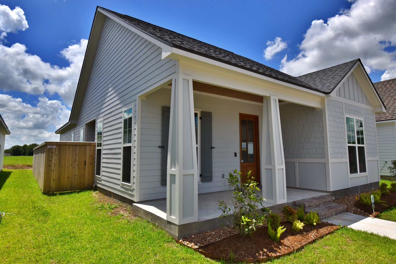 White home front exterior under blue sky